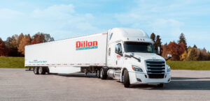 wide photo of white semi "dillon transportation" truck parked